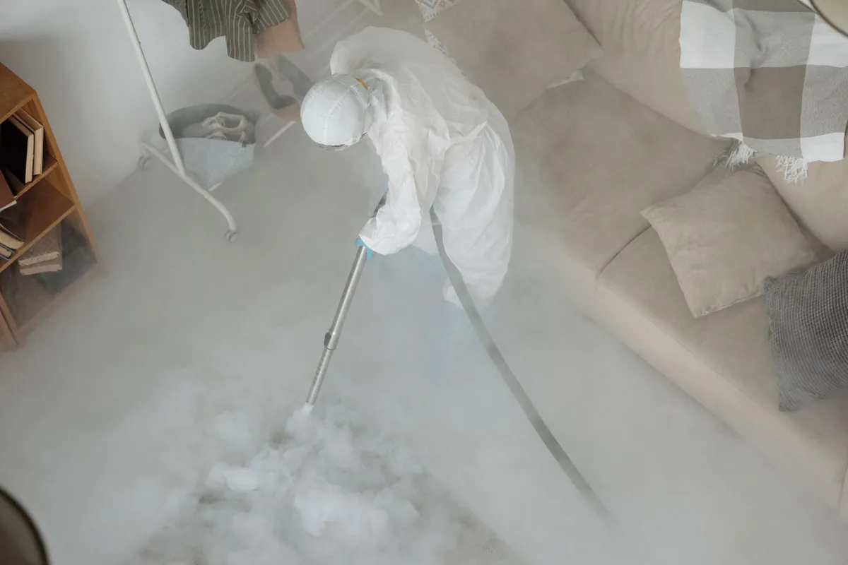 Biohazard cleanup technician in protective equipment, Bridge City, TX